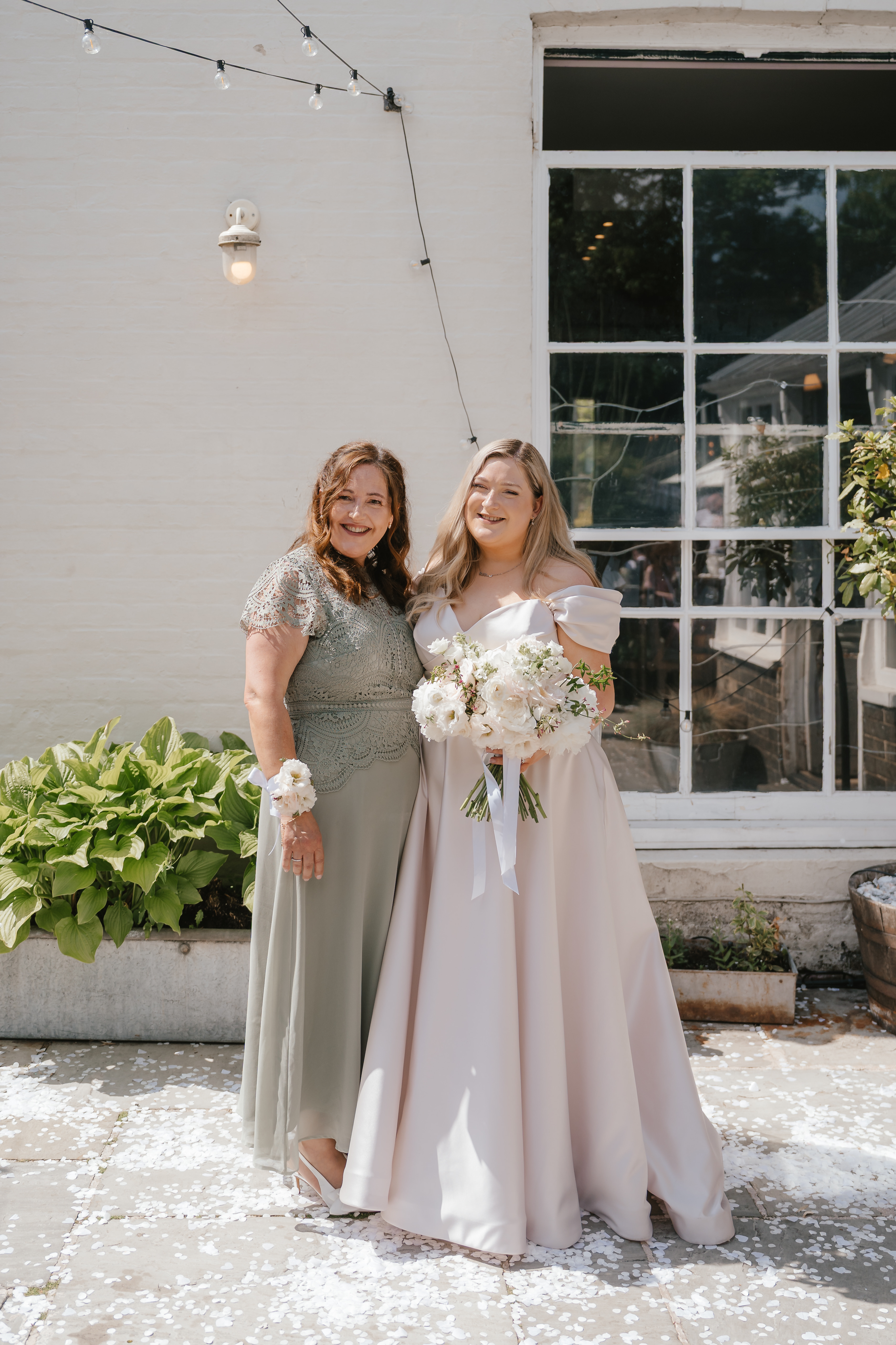 Photo of mother and daughter in wedding clothing