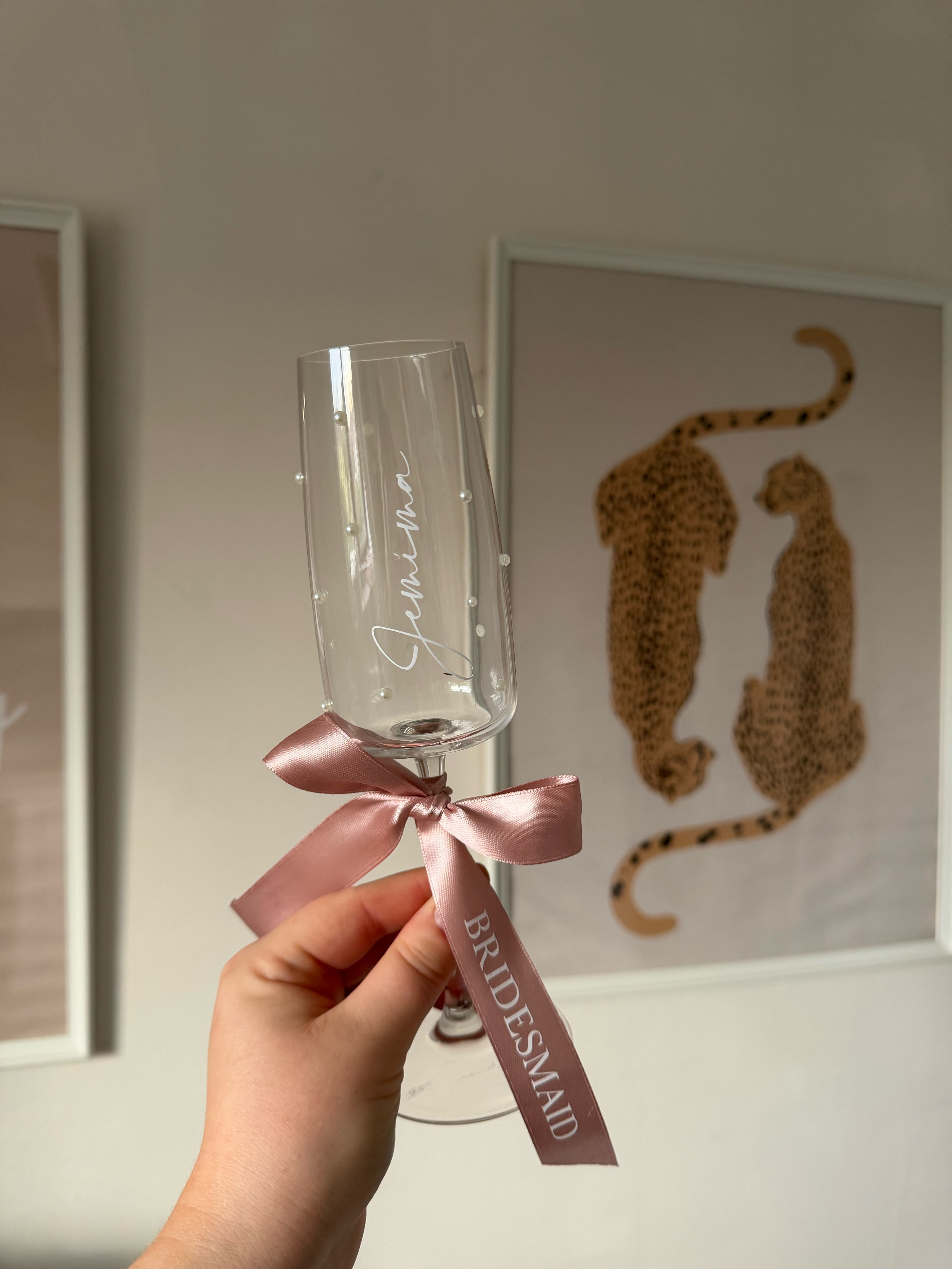Personalised prosecco glasses finished with blush ribbon