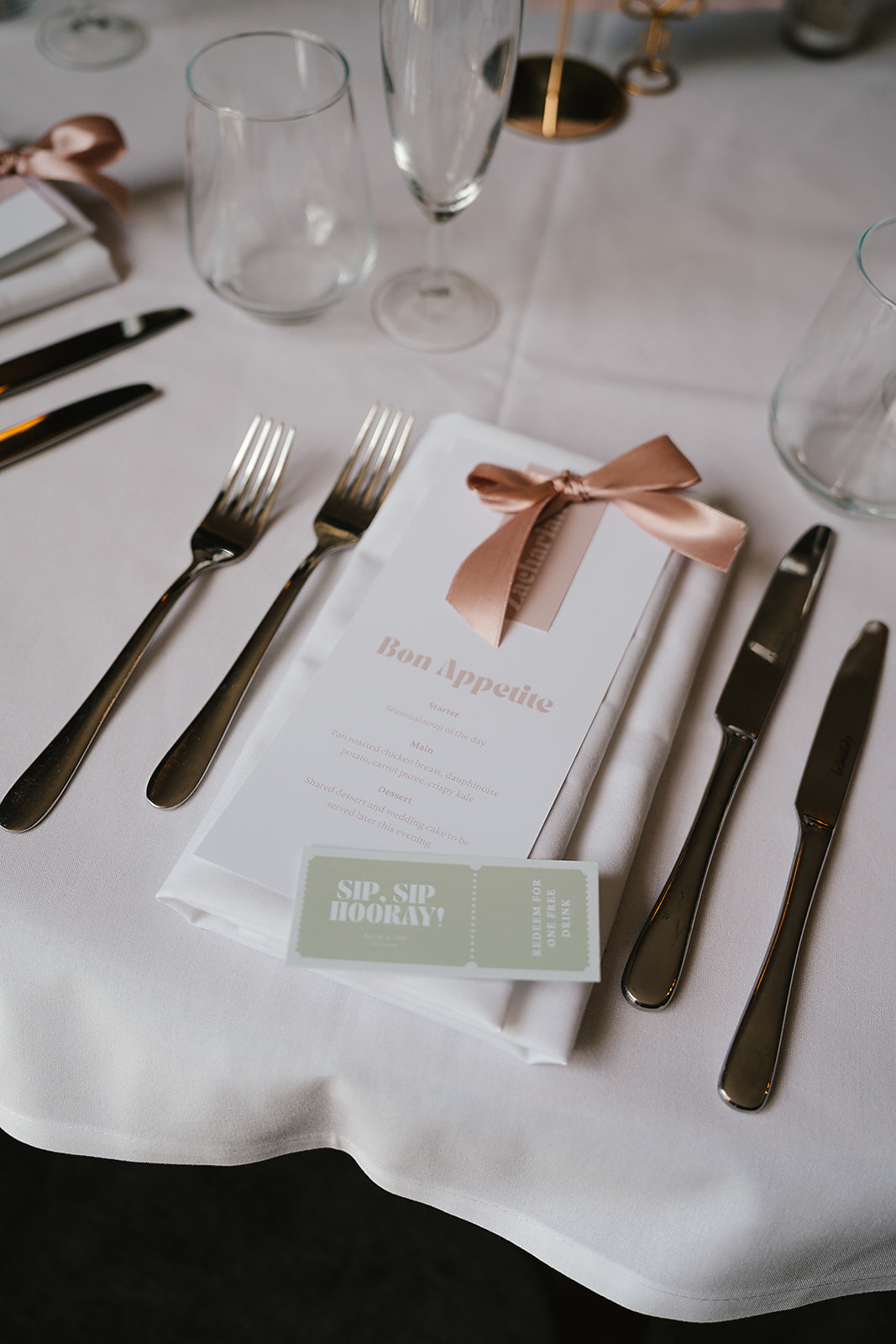 Wedding menu card finished with a blush ribbon name tag